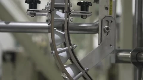 Sake Bottles Guided Through Stainless Rails on the Line Stock Footage 340010750