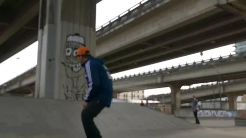 Sakeboardist jumping skating park Stock Footage 69889929