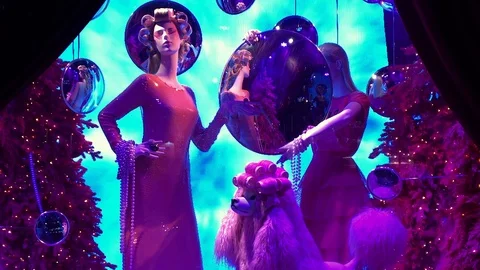 Saks 5th Ave Christmas Window: Female &amp; Poodle Mannequins Wear Hair Rollers Stock Footage 100565810