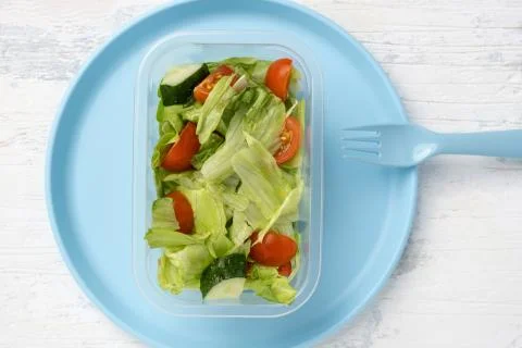 Salad and salad in plastic container Stock Photos