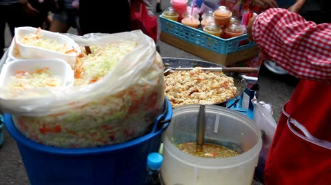 Salad and thai food on sale on the streets of Bangkok, Thailand Stock Footage