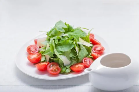 Salad with arugula, tomatoes Stock Photos