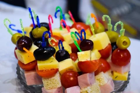 Salad assorted, on plastic sticks vegetables and cheese. Stock Photos