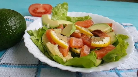 Salad with avocado salmon lemon Stock Footage 86906488