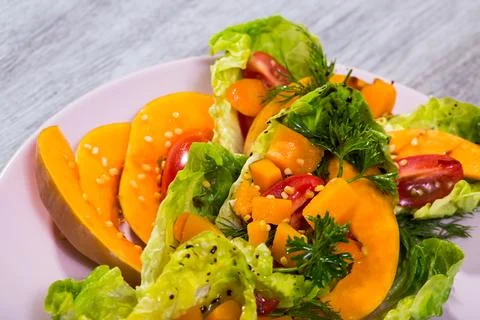 Salad with baked pumpkin. Stock Photos