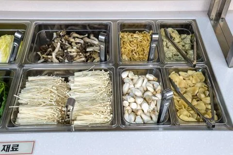 A salad bar with many different types of vegetables Stock Photos
