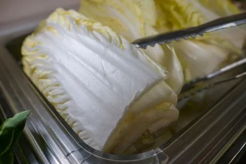 A salad bar with many different types of vegetables, cabbage Stock Photos