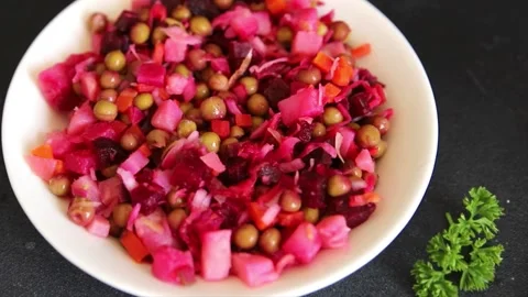 Salad beetroot and vegetables meatless dish beet, cabbage, onion, green peas Vidéo 344990932