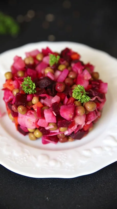 Salad beetroot and vegetables meatless dish beet, cabbage, onion, green peas Video stock 346398532