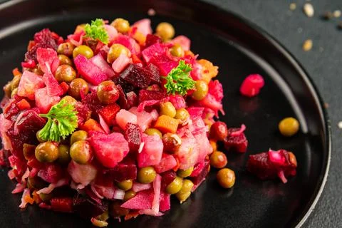 Salad beetroot and vegetables meatless dish beet, cabbage, onion, green pea.. Stock Photos