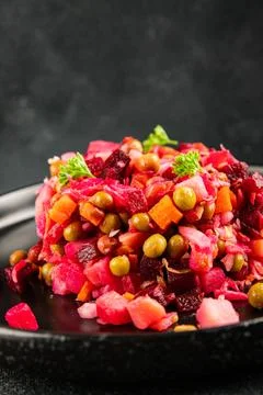 Salad beetroot and vegetables meatless dish beet, cabbage, onion, green pea.. Stock Photos