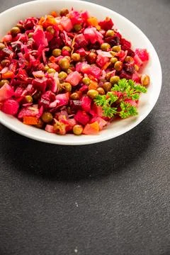 Salad beetroot and vegetables meatless dish beet, cabbage, onion, green pea.. Stock Photos