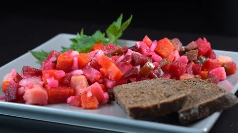 Salad from boiled vegetables, beetroot, carrot, potatoes, cucumber, rotates Stock Footage 97073359
