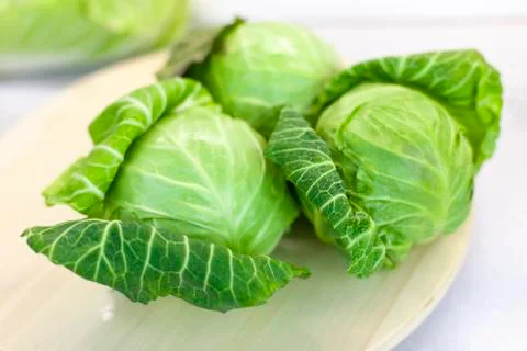 Salad cabbage on the kitchen table, farm vegetables Foto stock