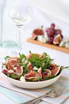 Salad with cheese, arugula with ham Stock Photos