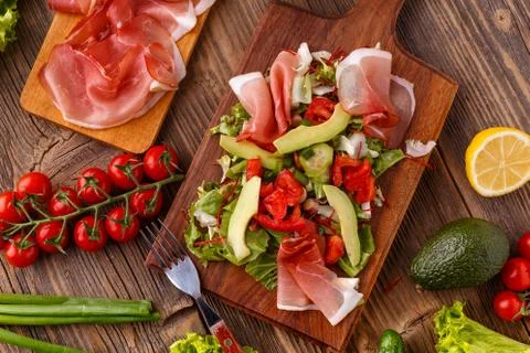 Salad with cured ham Stock Photos
