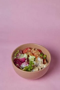 Salad in a deep dish, tomatoes, cucumbers, greens and cabbage, diet food for Stock Photos