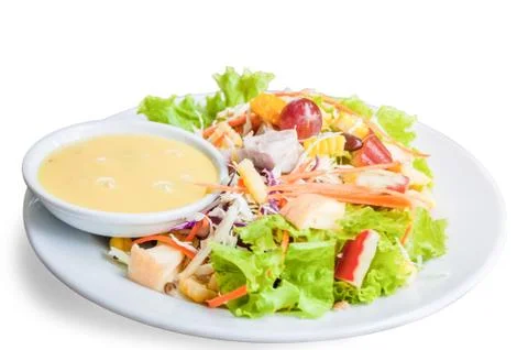 Salad with dressing on dish. Stock Photos