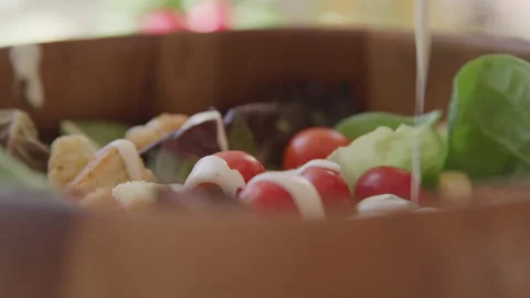 Salad Dressing Is Poured over Salad in Wood Bowl Stock Footage 208788888