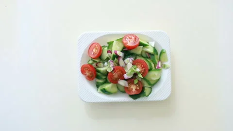 Salad of fresh cucumbers, cherry tomatoes and green onions Stock Footage 193373419
