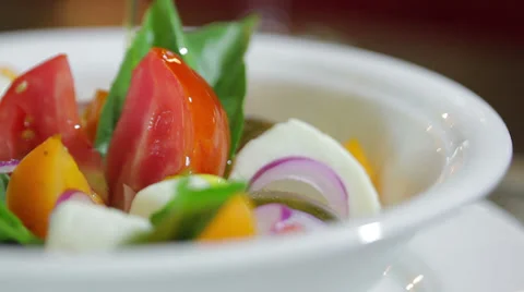 Salad with fresh tomatoes and mozzarella cheese Stock Footage 28539944