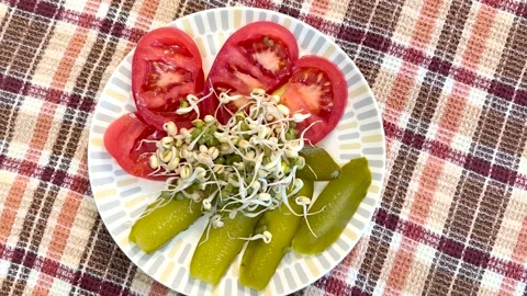 Salad of fresh vegetables and micro-greenery. Tomatoes, apples, pickles, finely Stock Footage 270986728