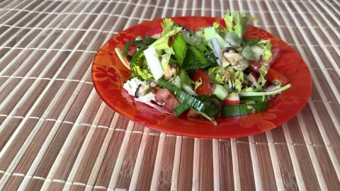 Salad with fresh vegetables like celery, tomatoes, cucumbers, garlic arrows Stock Footage 275752776