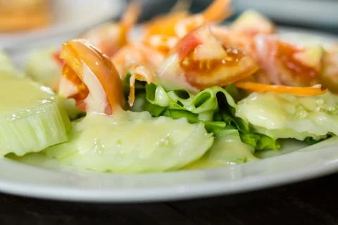 Salad of fresh vegetables on the table. Photos