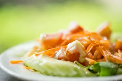 Salad of fresh vegetables on the table. 写真素材