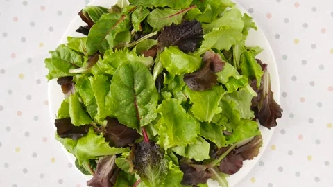Salad greens on a plate. Video stock 247483992