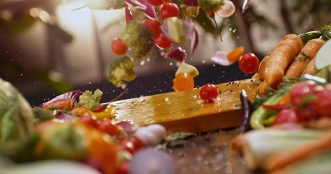 Salad ingredients falling on table Stock-Footage 311833103