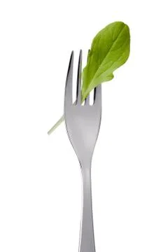 Salad leaf on fork isolated Stock Photos