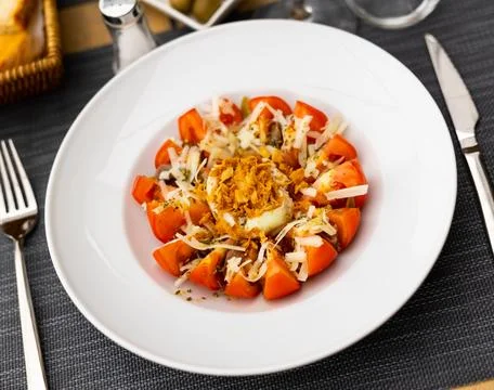 Salad made of tomato and deviled egg served on table Stock Photos