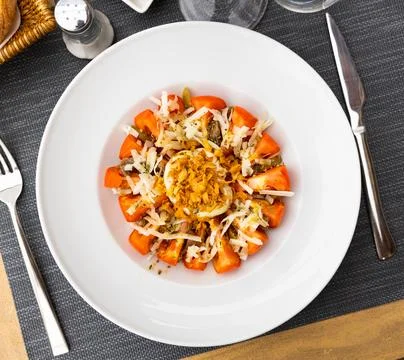 Salad made of tomato and deviled egg served on table Stock Photos