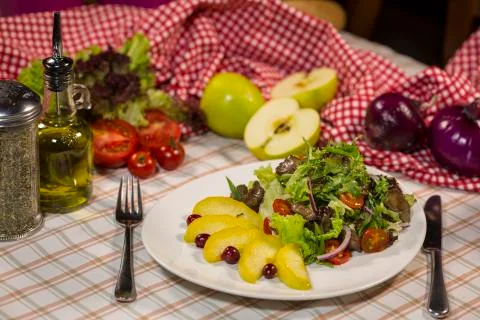 Salad with meat and arugula. Salad with duck meat, baked apple and arugula Stock Photos