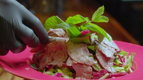 Salad with meat in the restaurant Video stock 95865720