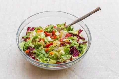 Salad of mozzarella, fresh vegetables and different leaf lettuce Fotos Stock