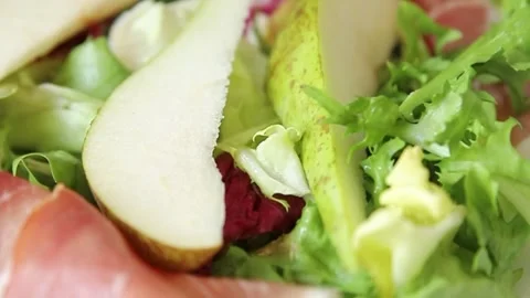 Salad pear slice, ham, vegetable, green leaf salad dish Video stock 307627576