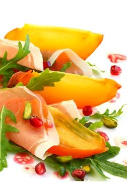 Salad with persimmon Stock Photos