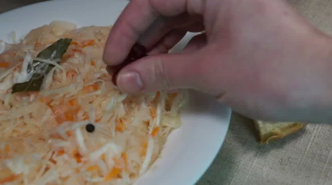 Salad of pickled cabbage with cranberries, carrots, bay leaf Stock Footage 59081054