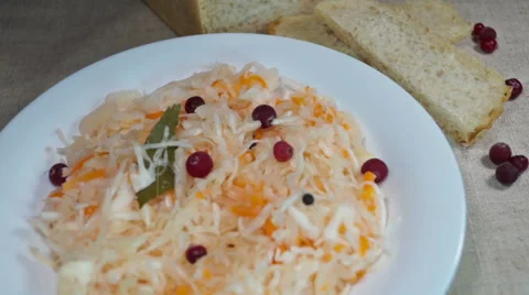 Salad of pickled cabbage with cranberries, carrots, bay leaf Stock Footage 59081112