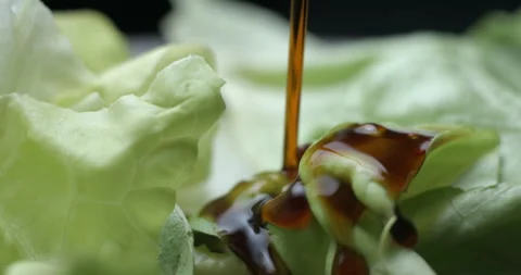 Salad preparing with sauces macro slowmotion Stock Footage 137924802
