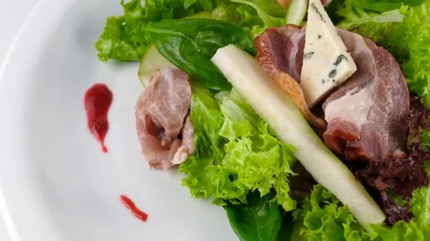 Salad with prosciutto or ham and cheese, close-up view, Gourmet food Stock Footage 81001999