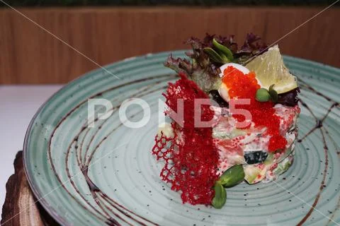 Salad with red caviar and cheese chips Stock Photos