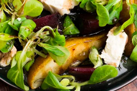 Salad of roasted beetroot, pear, lamb's lettuce, cheese Stock Photos