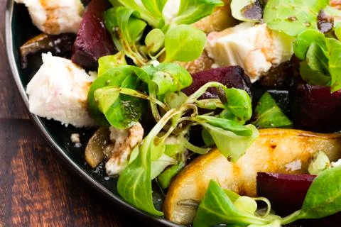 Salad of roasted beetroot, pear, lamb's lettuce, cheese Stock Photos