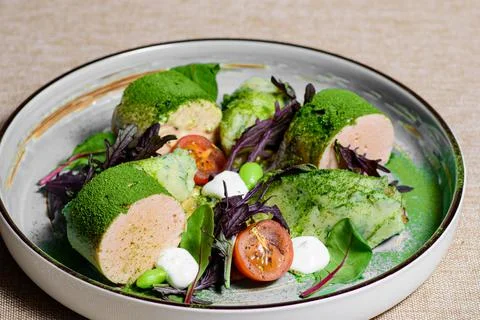 Salad with sausage, tomatoes, basil and lettuce Stock Photos