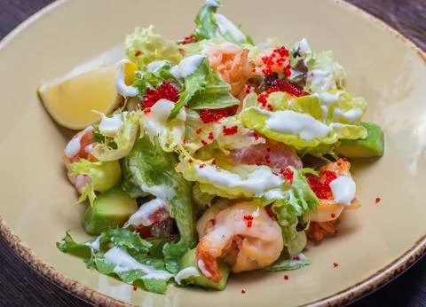 Salad with shrimp and caviar Stock Photos