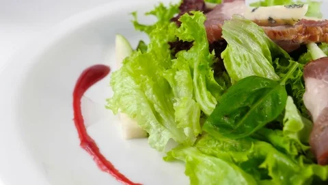 Salad with sliced ham, cheese and pear, close-up view Stock Footage 81002356