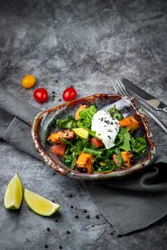 Salad with spinach, eel, lime, sour cream, side view Stock Photos